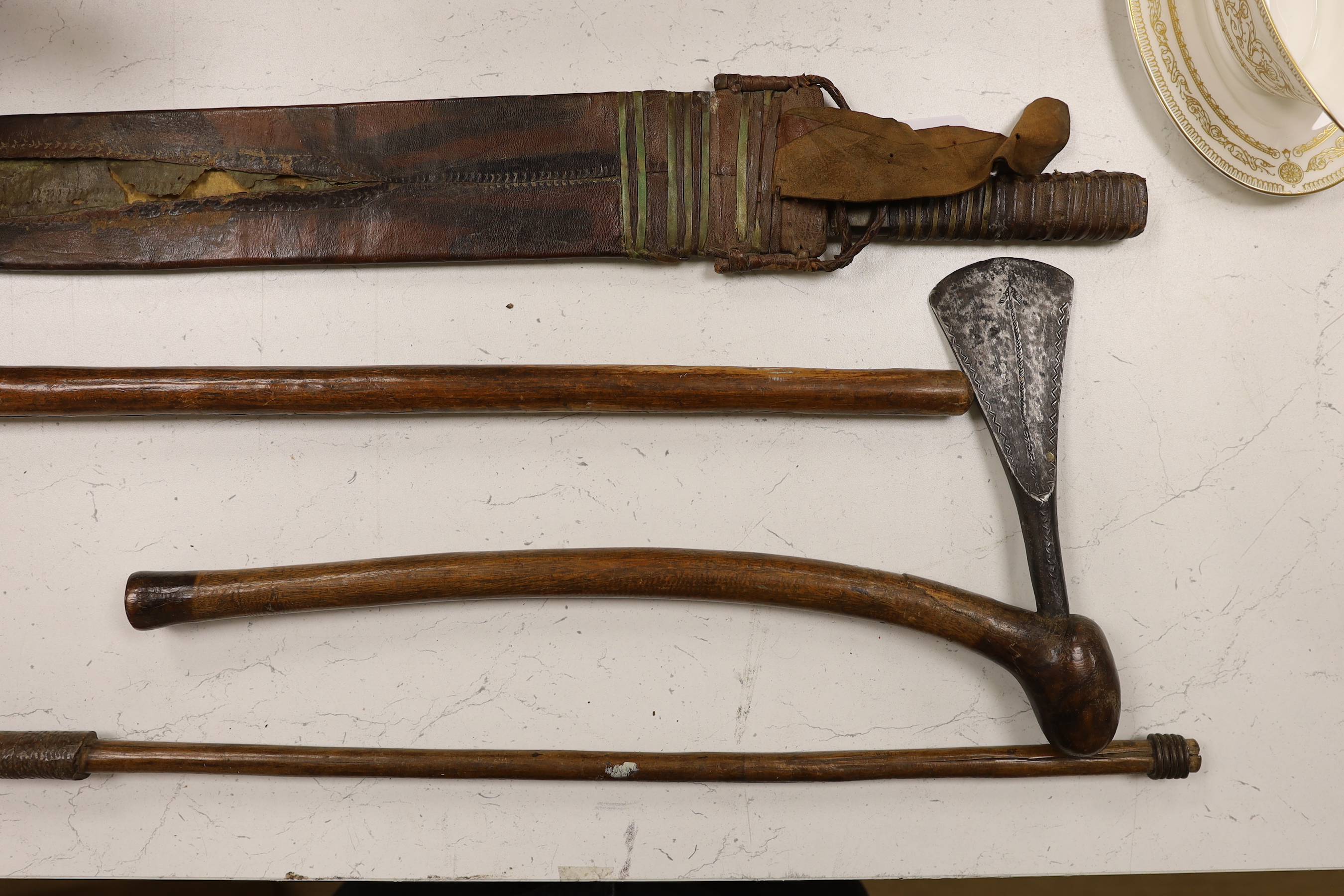 Zulu weapons and a machete, the blade stamped ‘Grape? Robert. M. Needham Sheffield’